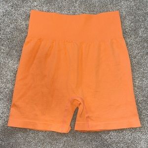 Orange ribbed biker shorts